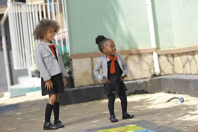 Two pupils chatting in the school courtyard