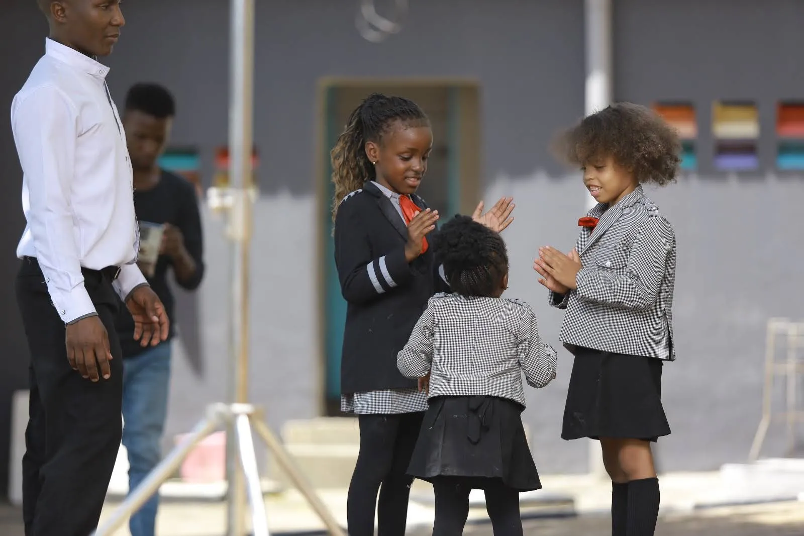 Marvels Academy children greeting each other in the morning, with a teacher nearby
